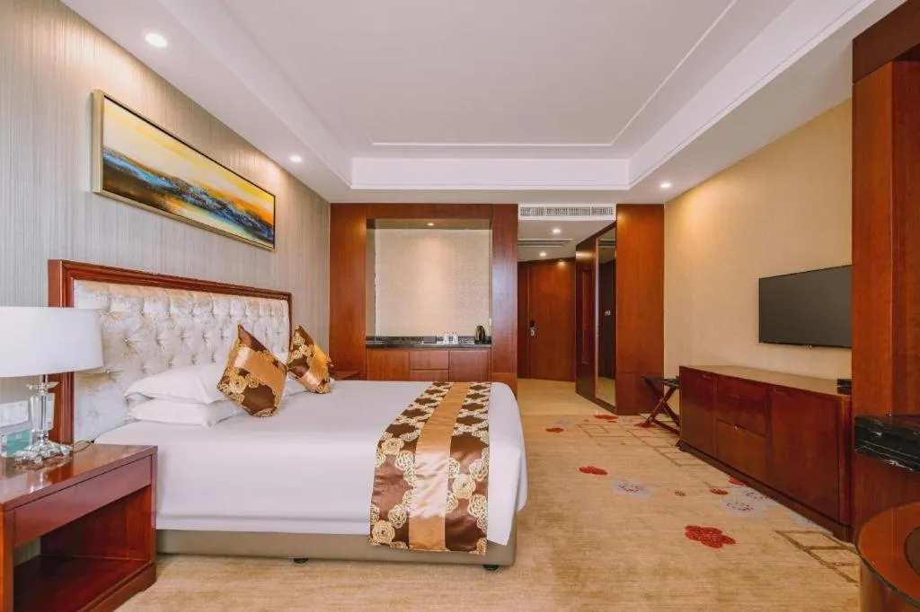 Bed in New Century Hotel Putuo Zhoushan