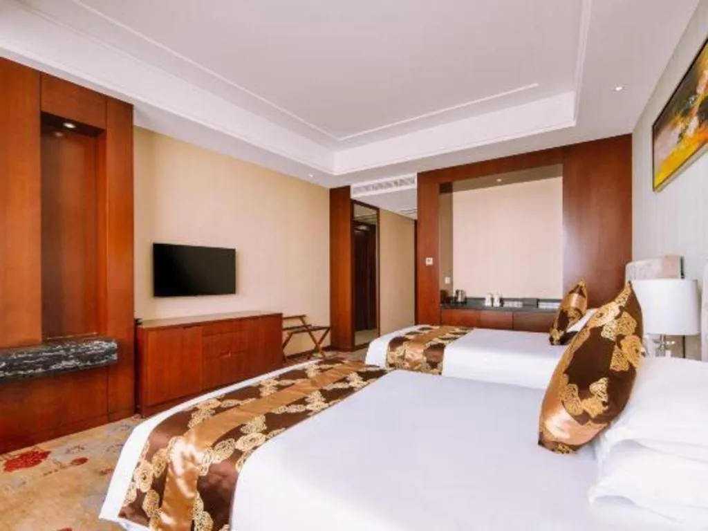 Bed in New Century Hotel Putuo Zhoushan