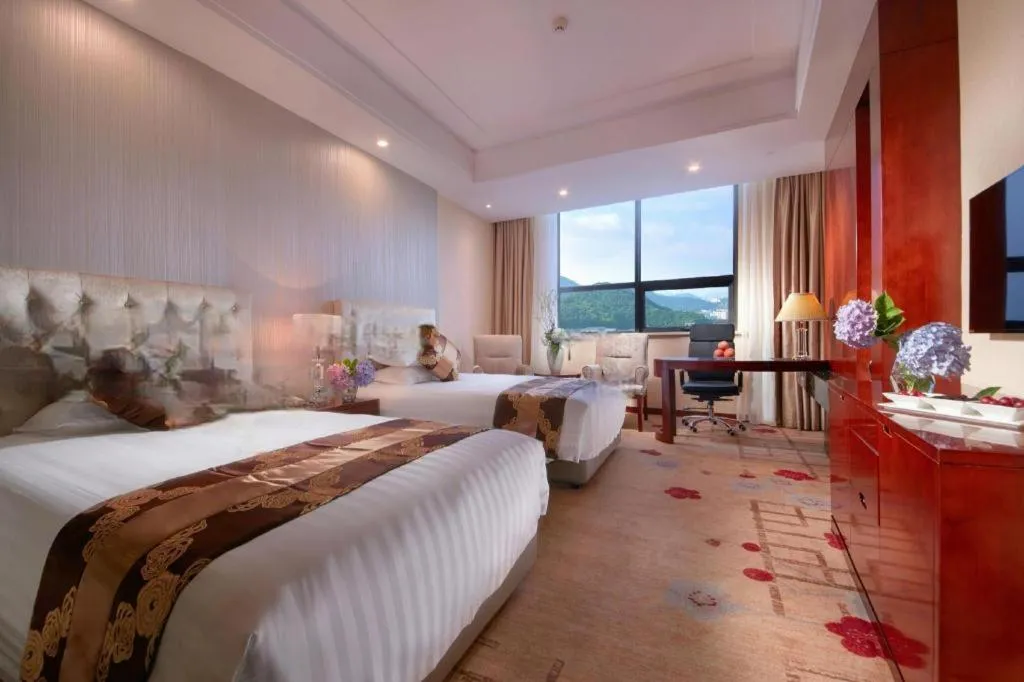Bed in New Century Hotel Putuo Zhoushan