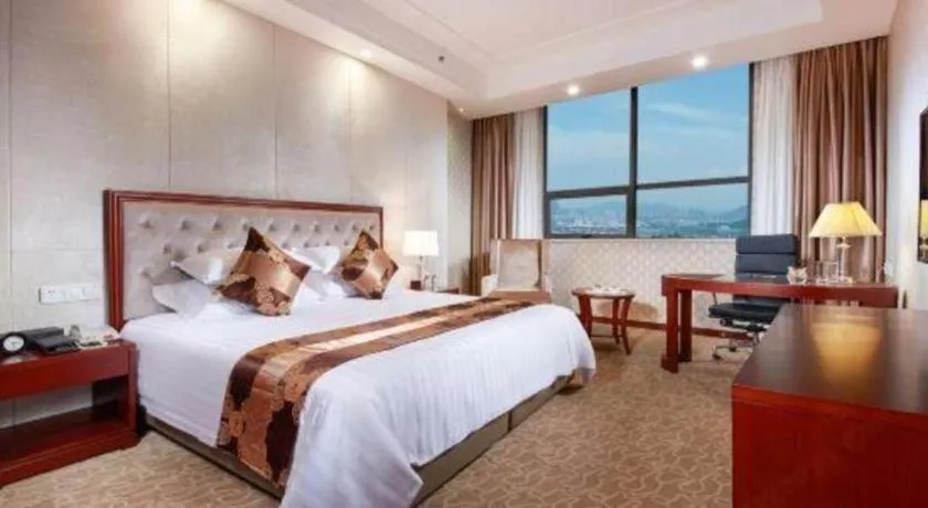 Bed in New Century Hotel Putuo Zhoushan