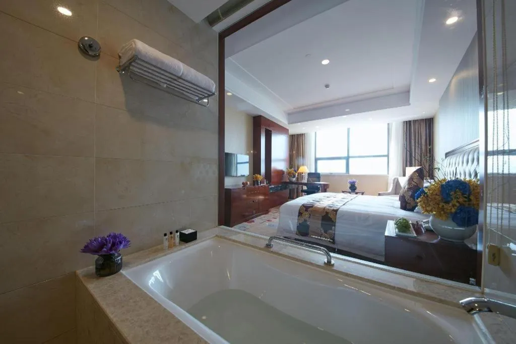 Bed in New Century Hotel Putuo Zhoushan