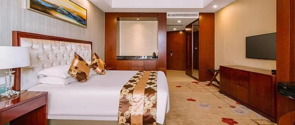 Bed in New Century Hotel Putuo Zhoushan