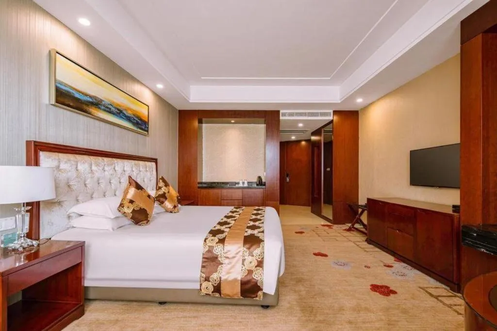 Bed in New Century Hotel Putuo Zhoushan