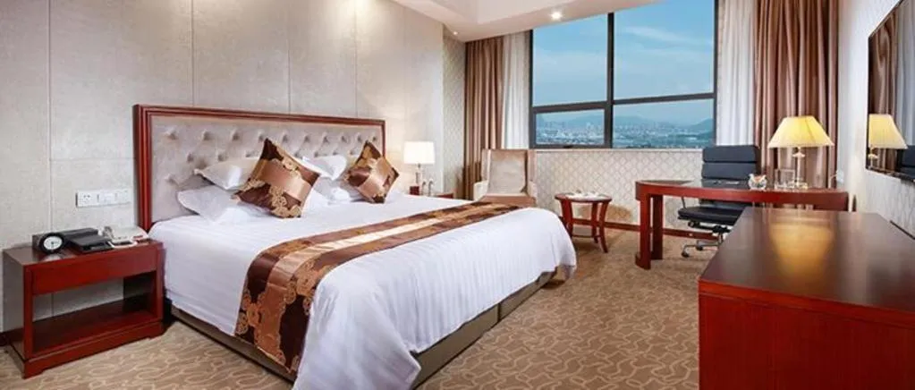 Bed in New Century Hotel Putuo Zhoushan