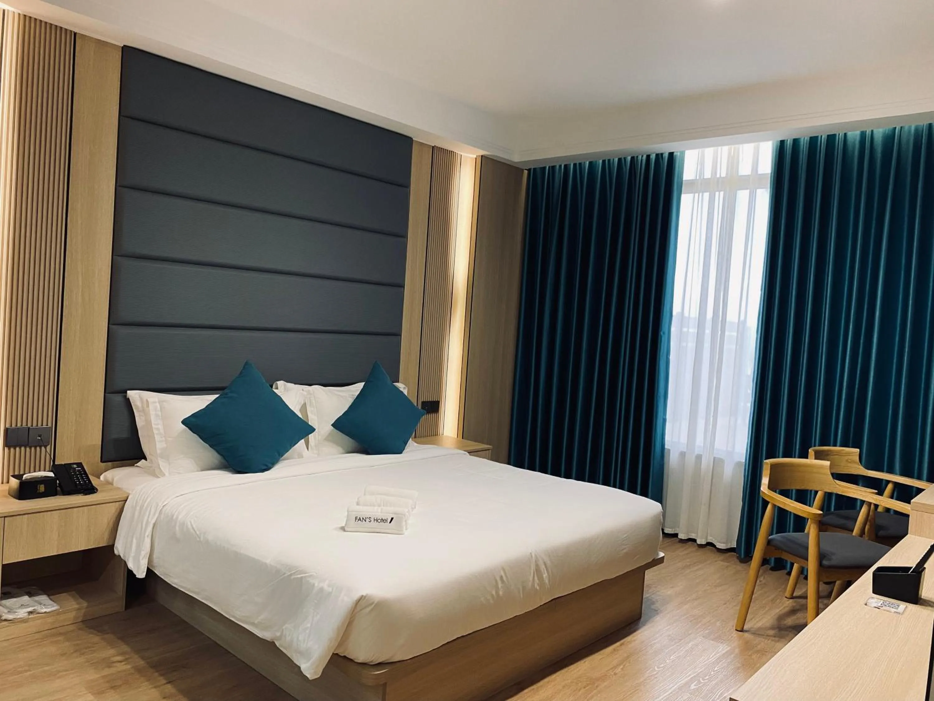 Bed in Fan's Hotel Palo