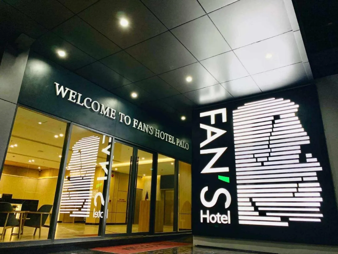 Property logo or sign in Fan's Hotel Palo