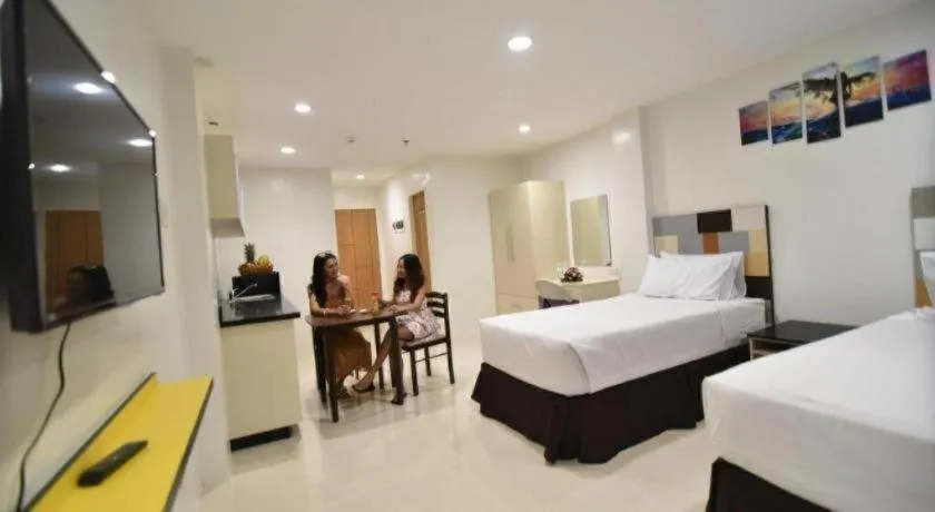 Bed in Holiday Oceanview Residences and Resort