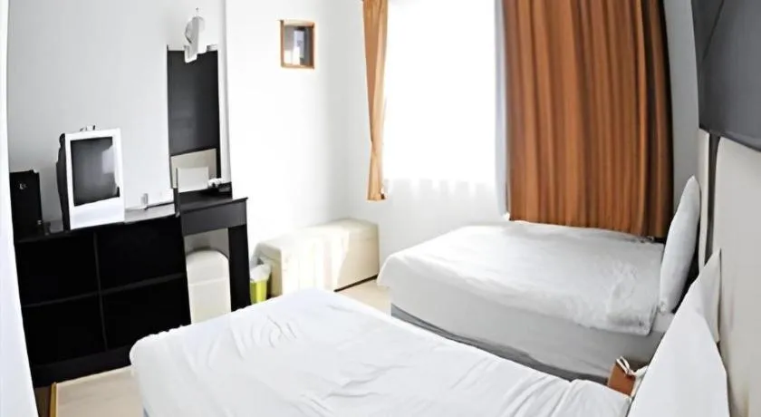 Bed in Cactus Resort & Hotel