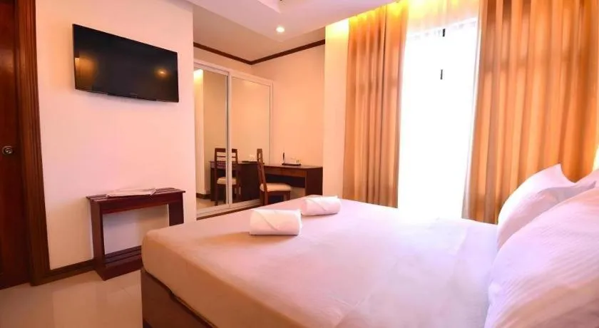 Bed in Ipil Suites Puerto Princesa