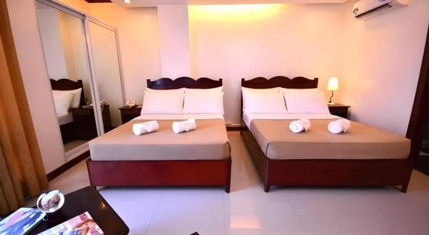 Bed in Ipil Suites Puerto Princesa