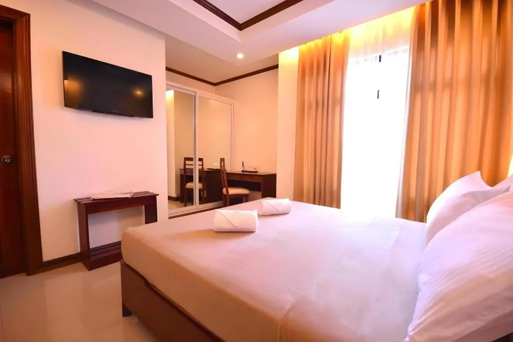 Bed in Ipil Suites Puerto Princesa