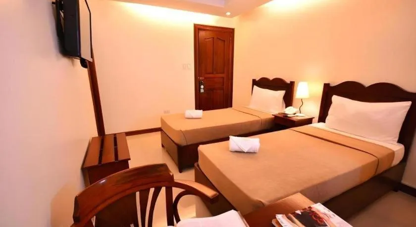 Bed in Ipil Suites Puerto Princesa