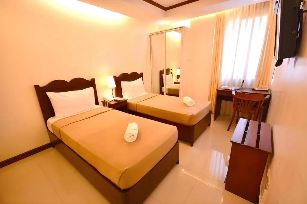 Bed in Ipil Suites Puerto Princesa