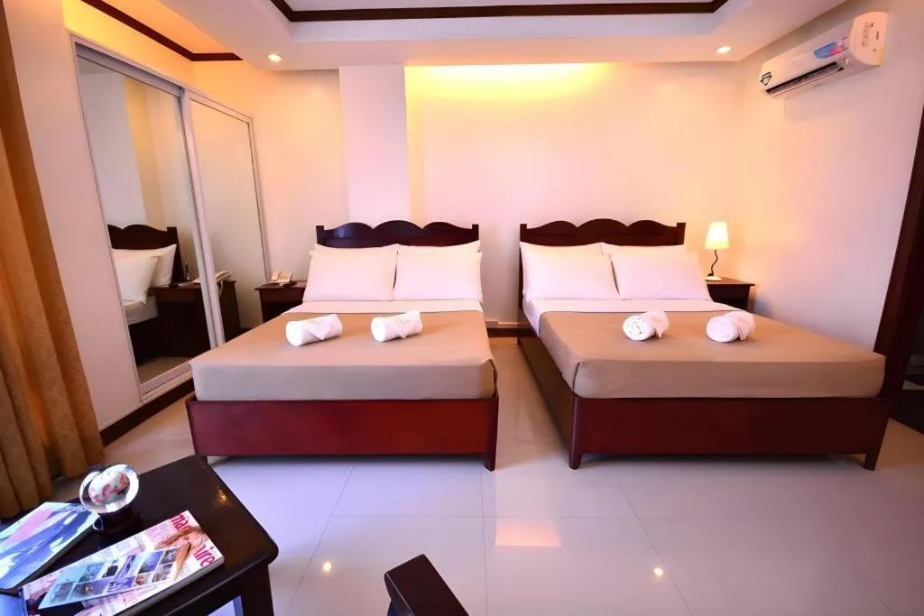Bed in Ipil Suites Puerto Princesa