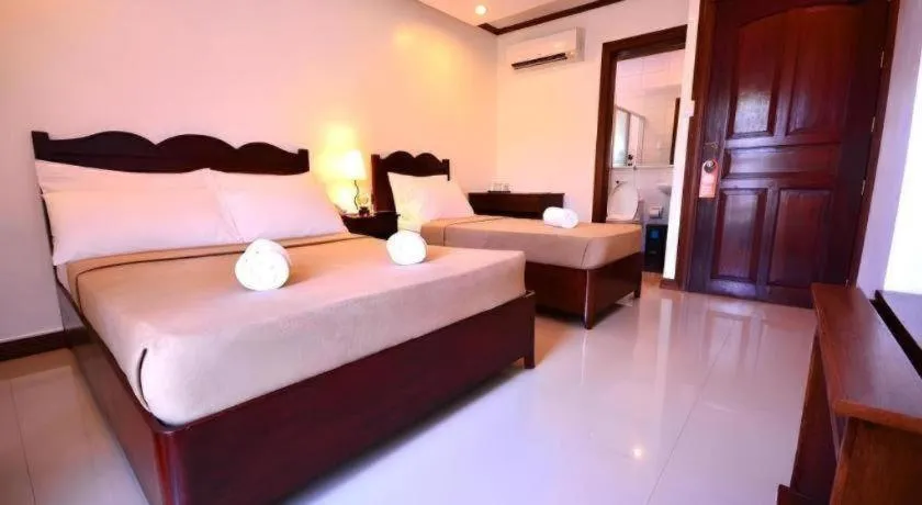 Bed in Ipil Suites Puerto Princesa