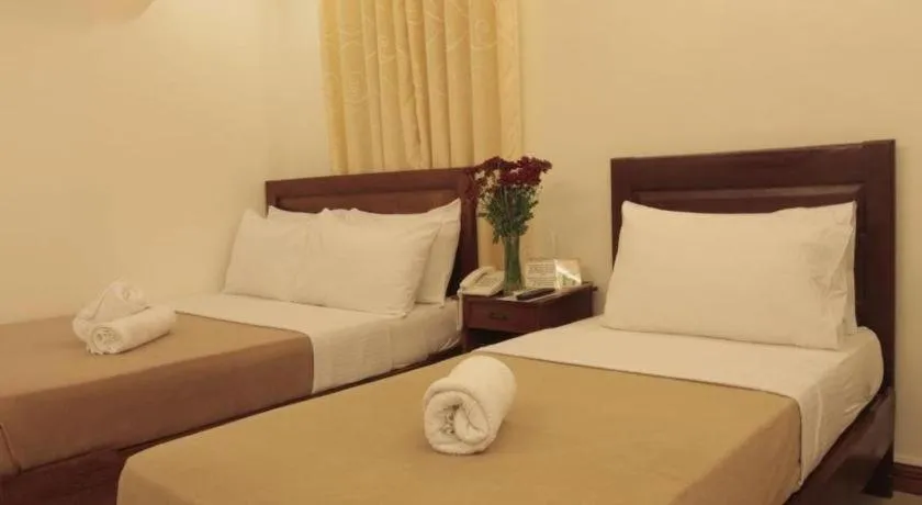 Bed in Ipil Suites Puerto Princesa