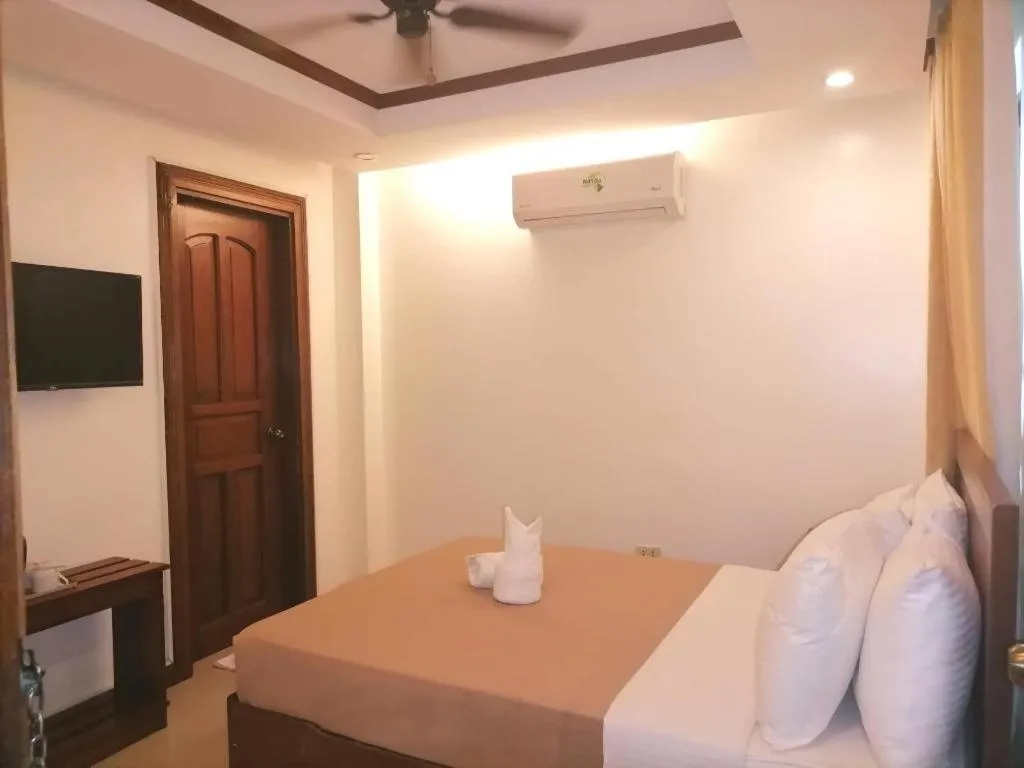 Bed in Ipil Suites Puerto Princesa