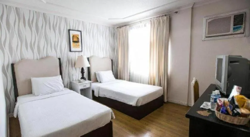 Bed in Queen Margarette Hotel