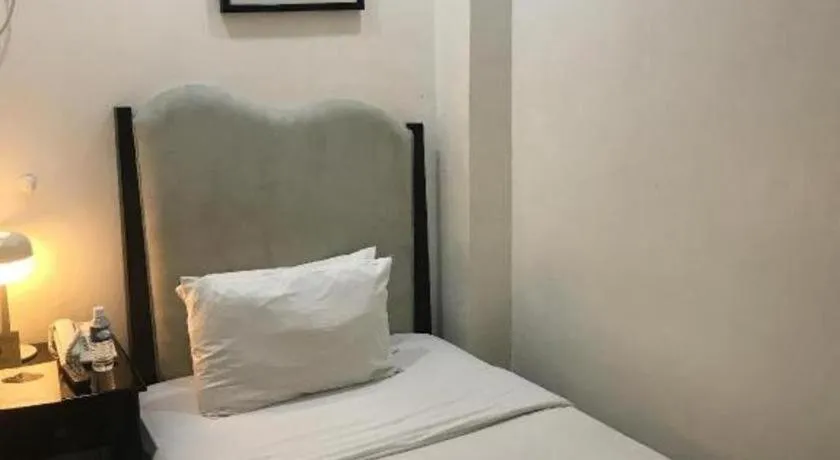Bed in Queen Margarette Hotel