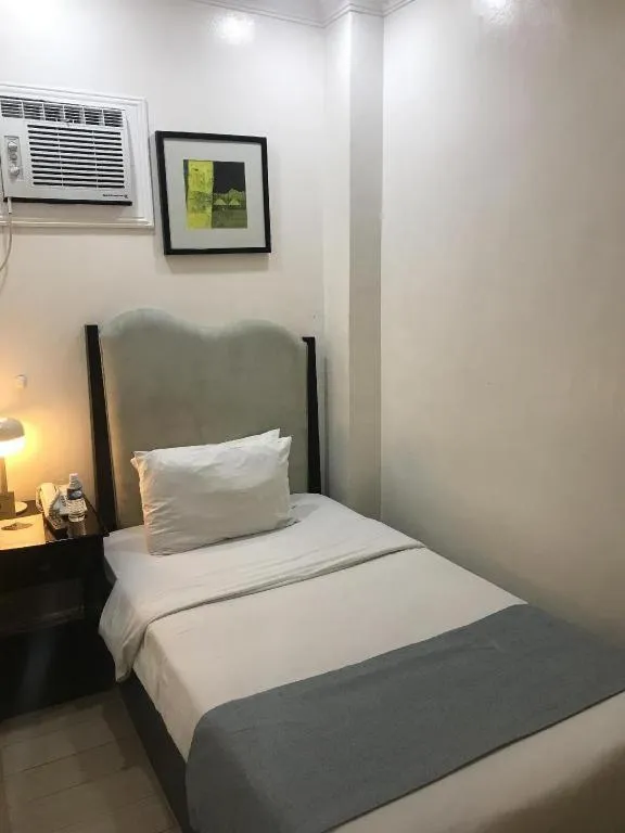 Bed in Queen Margarette Hotel