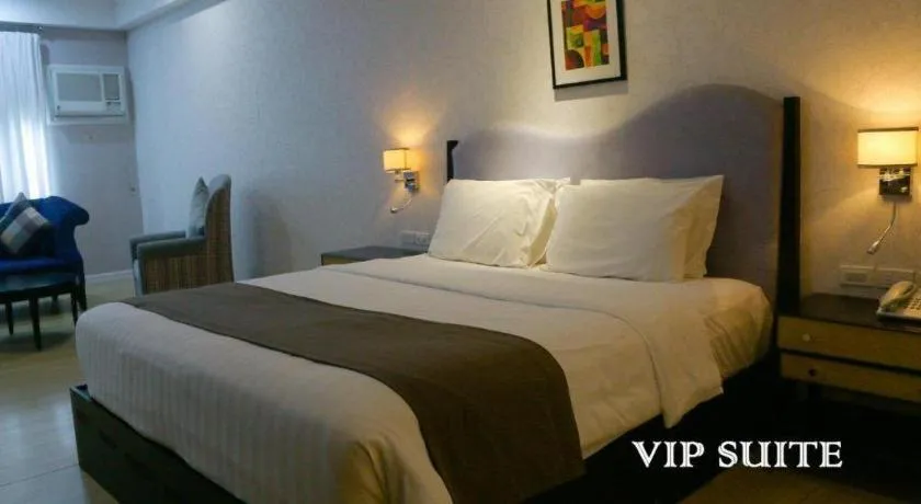 Bed in Queen Margarette Hotel