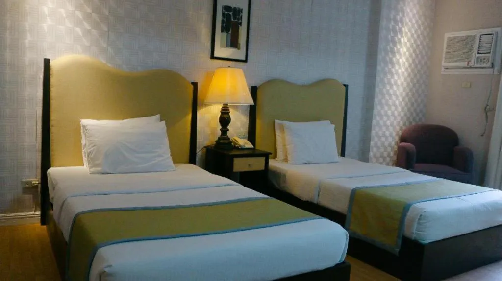 Bed in Queen Margarette Hotel