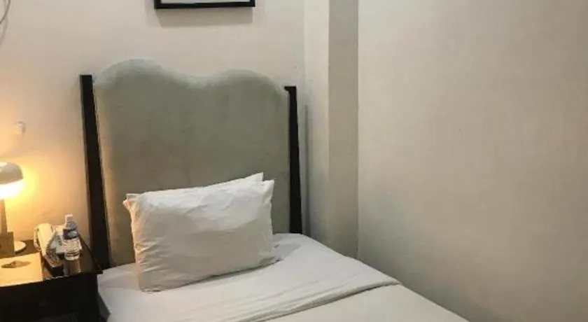 Bed in Queen Margarette Hotel