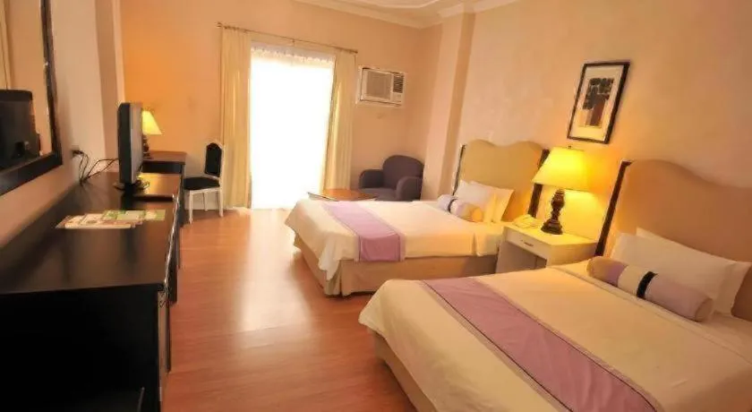 Bed in Queen Margarette Hotel