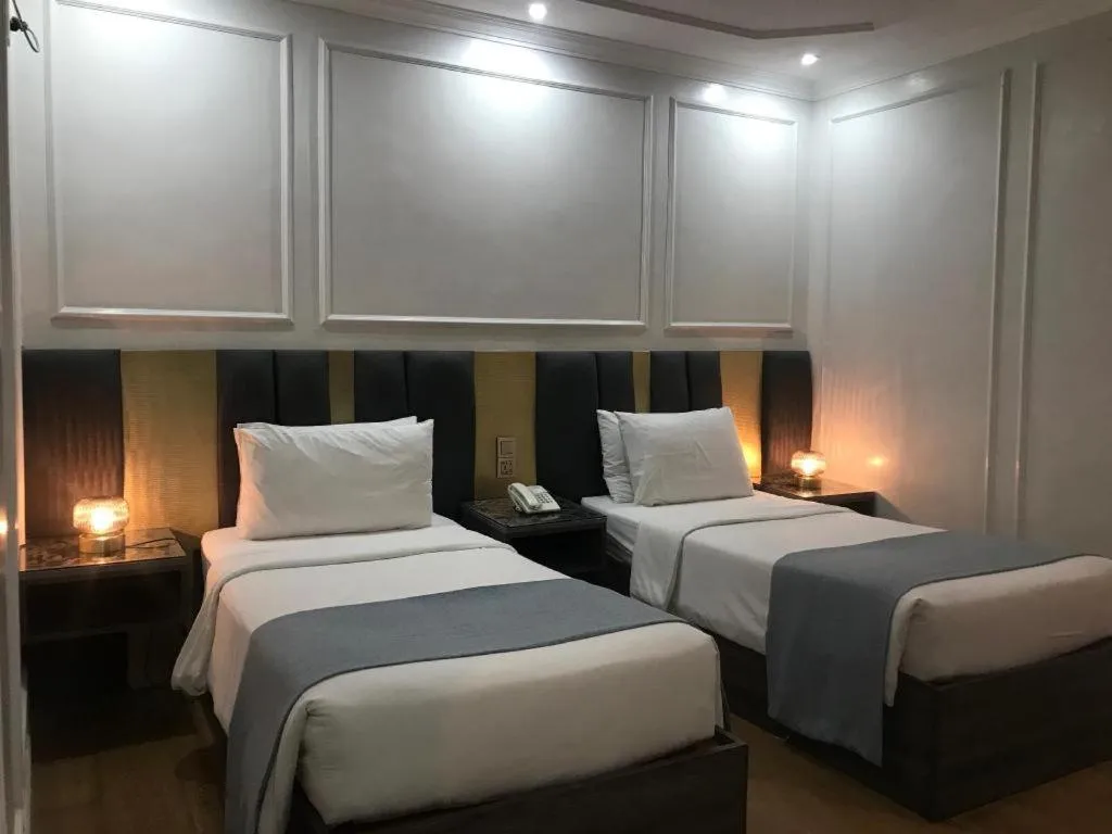 Bed in Queen Margarette Hotel