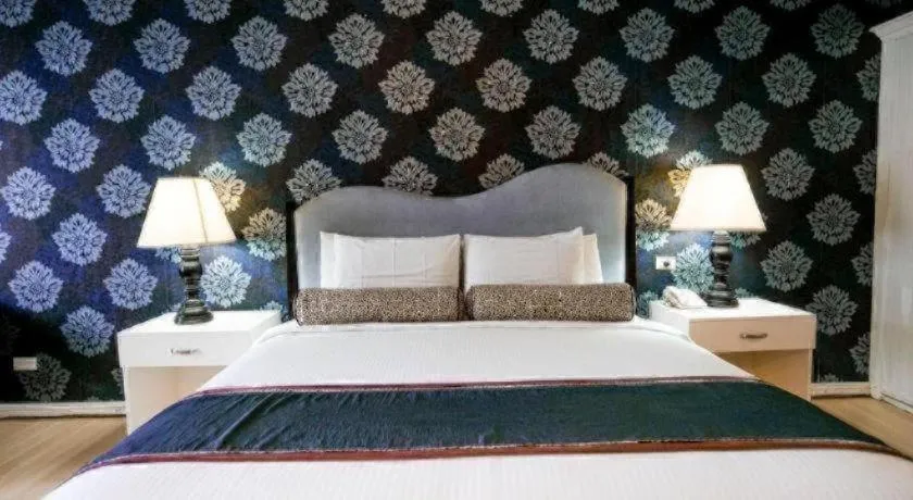 Bed in Queen Margarette Hotel