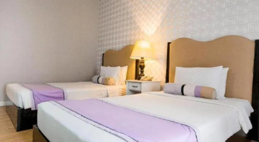 Bed in Queen Margarette Hotel