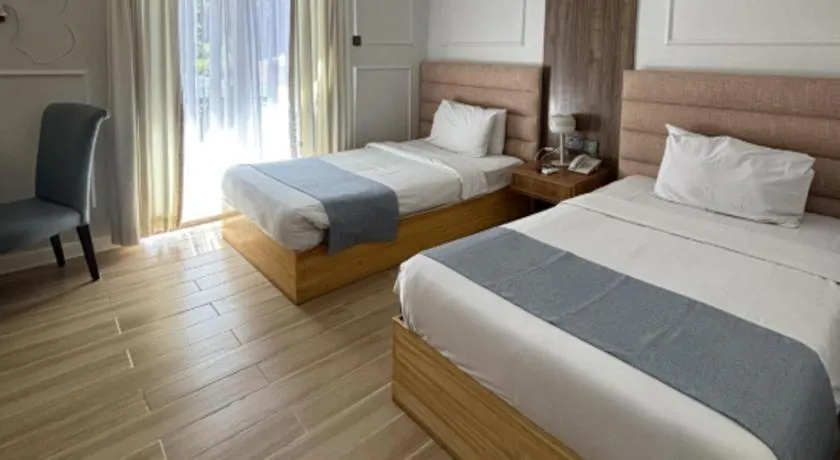 Bed in Queen Margarette Hotel