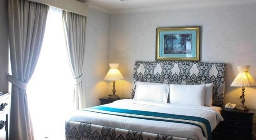 Bed in Queen Margarette Hotel