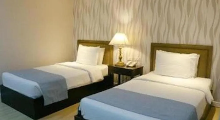 Bed in Queen Margarette Hotel