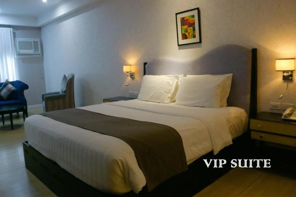 Bed in Queen Margarette Hotel