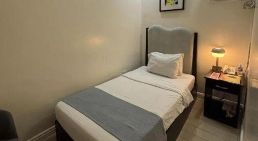 Bed in Queen Margarette Hotel