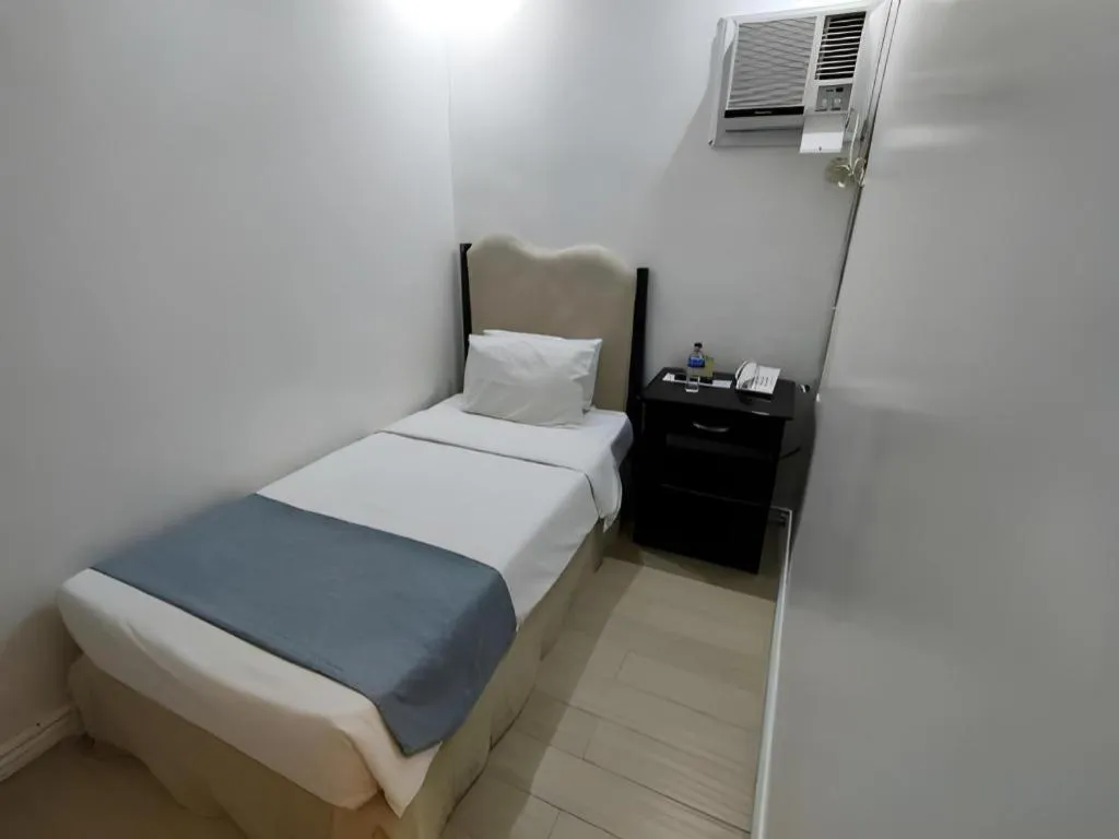 Bed in Queen Margarette Hotel