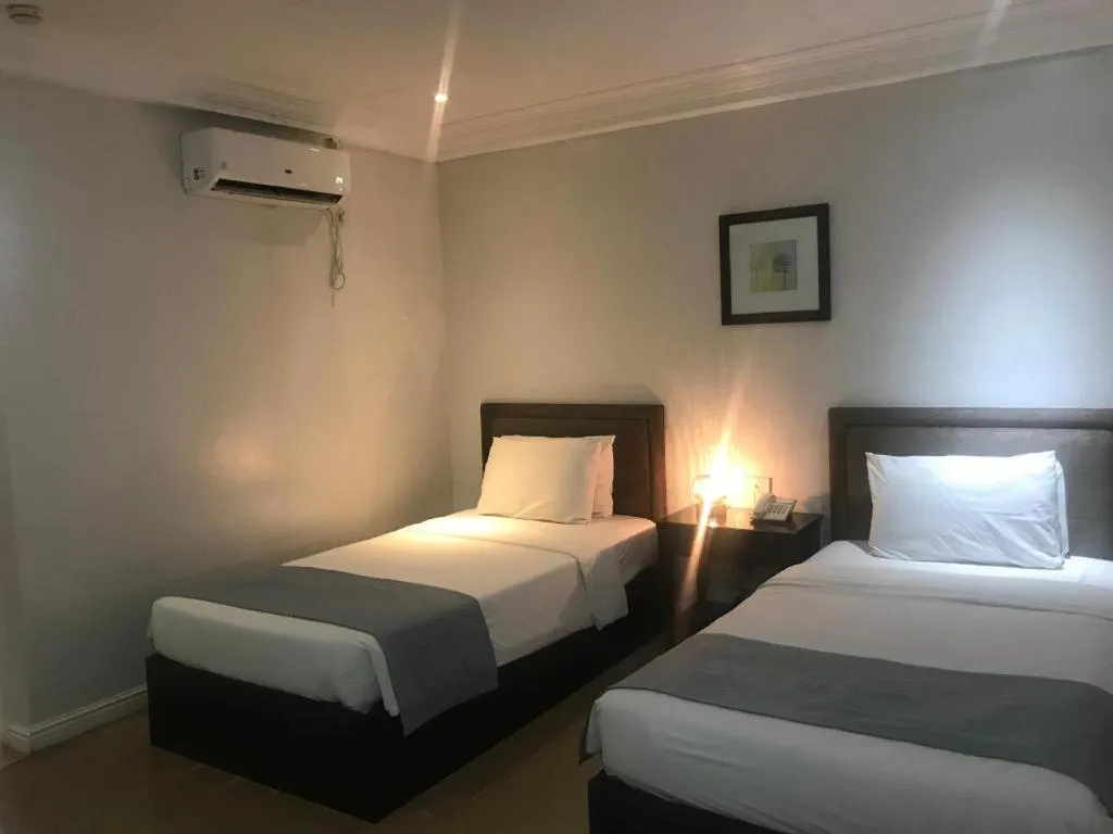 Bed in Queen Margarette Hotel