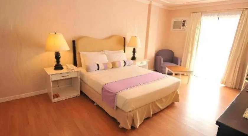 Bed in Queen Margarette Hotel