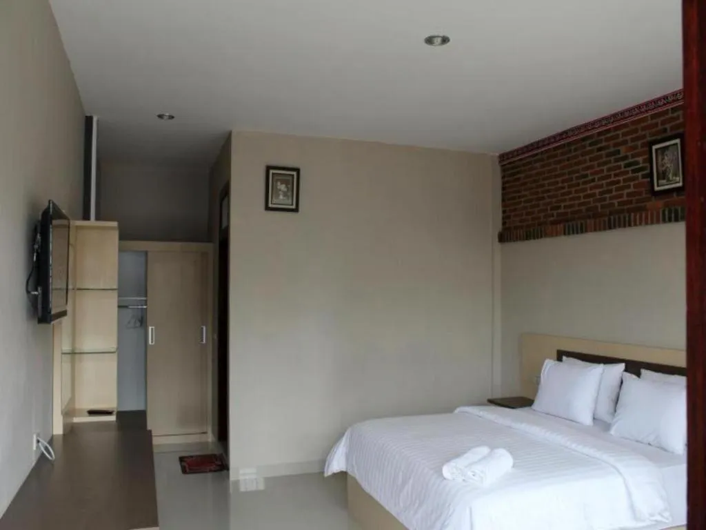 Bed in Samosir Cottages Resort