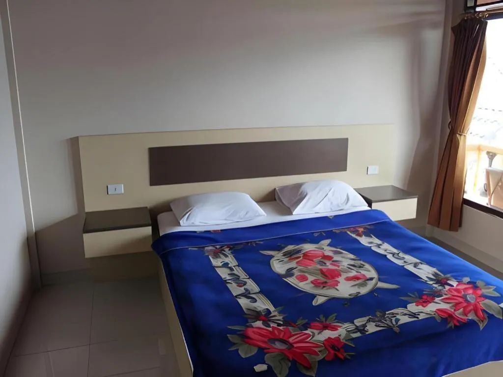Bed in Samosir Cottages Resort