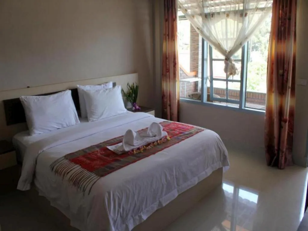 Bed in Samosir Cottages Resort