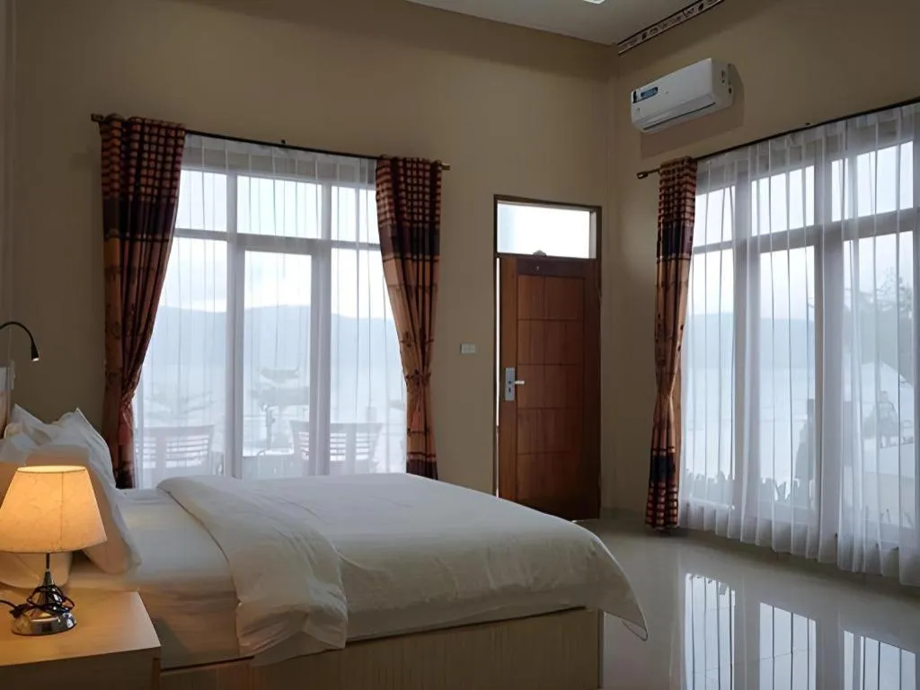 Bed in Samosir Cottages Resort