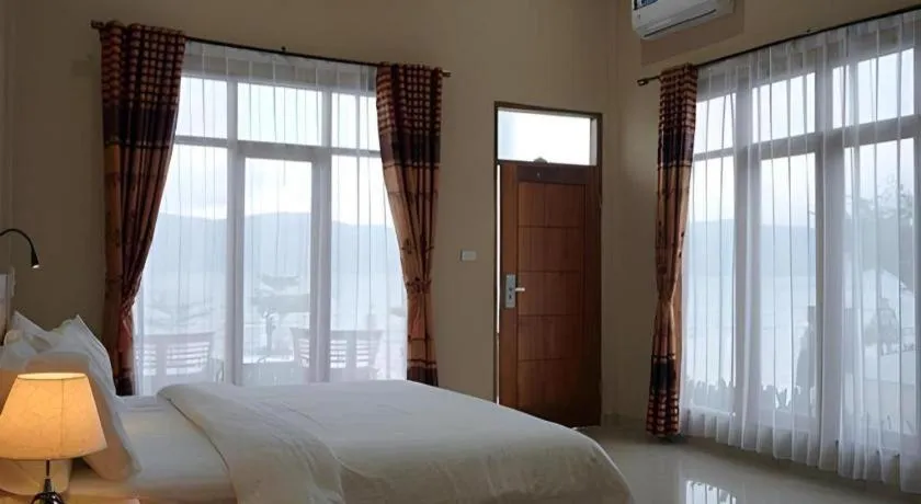 Bed in Samosir Cottages Resort