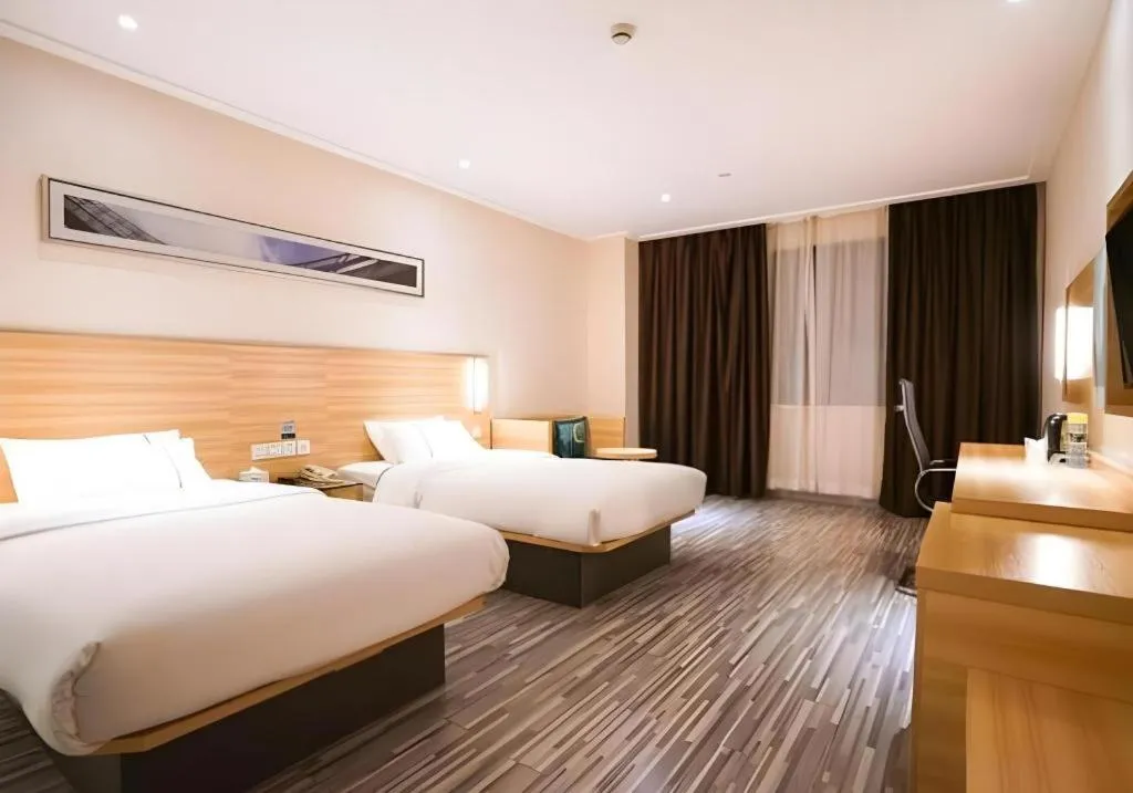 Bed in City Comfort Inn Wuhan High Speed Railway Station