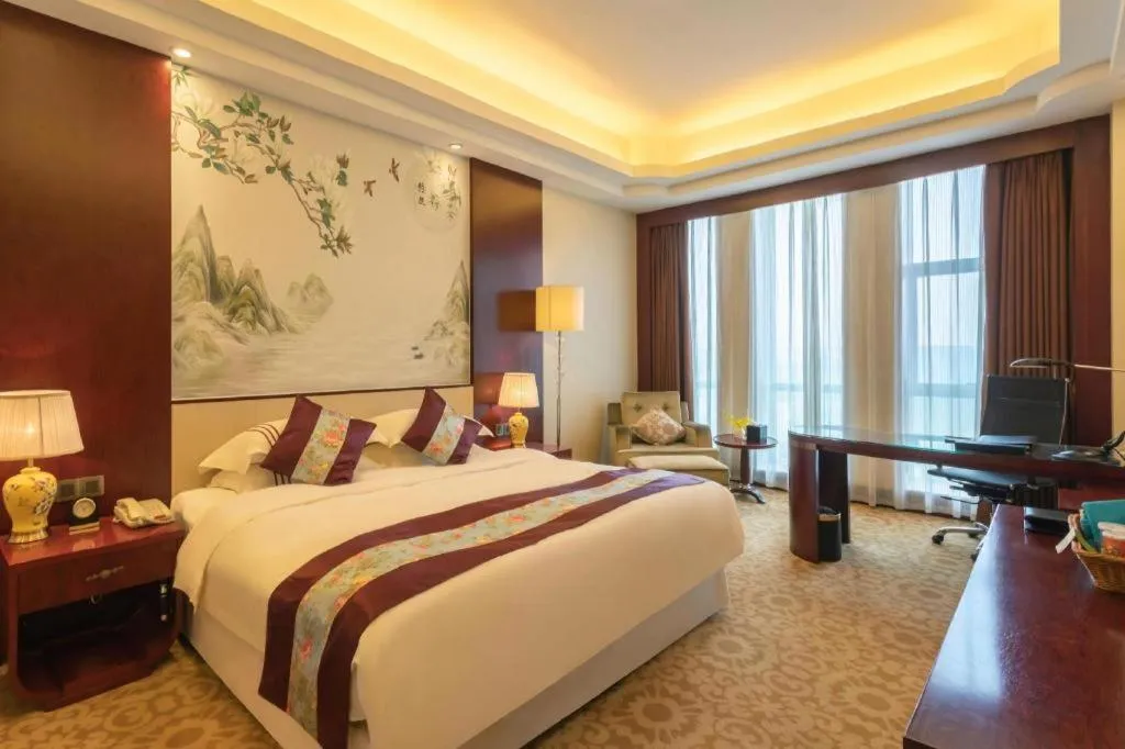 Bed in Dezhou Regal Kangbo Hotel