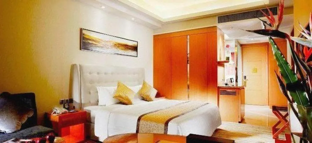 Bed in Dezhou Regal Kangbo Hotel