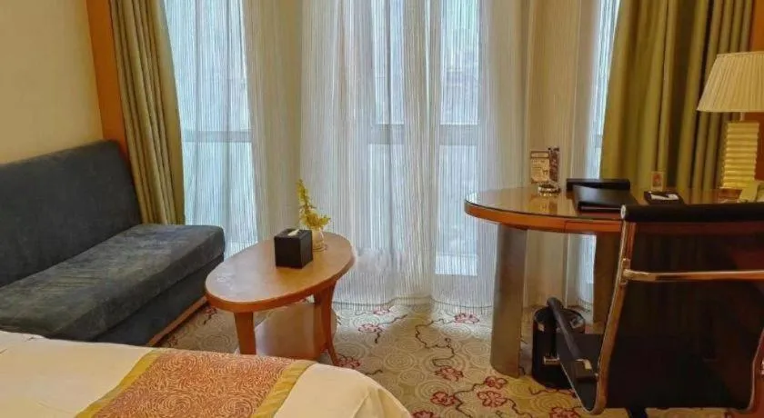 Bed in Dezhou Regal Kangbo Hotel