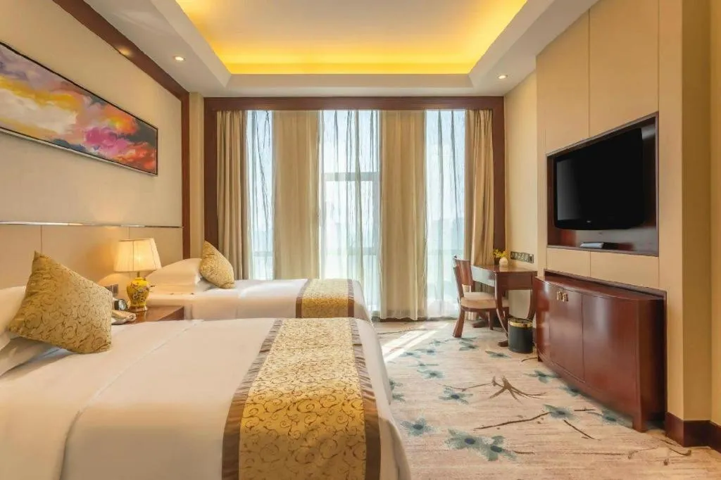 Bed in Dezhou Regal Kangbo Hotel