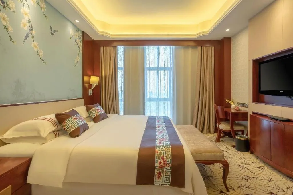 Bed in Dezhou Regal Kangbo Hotel